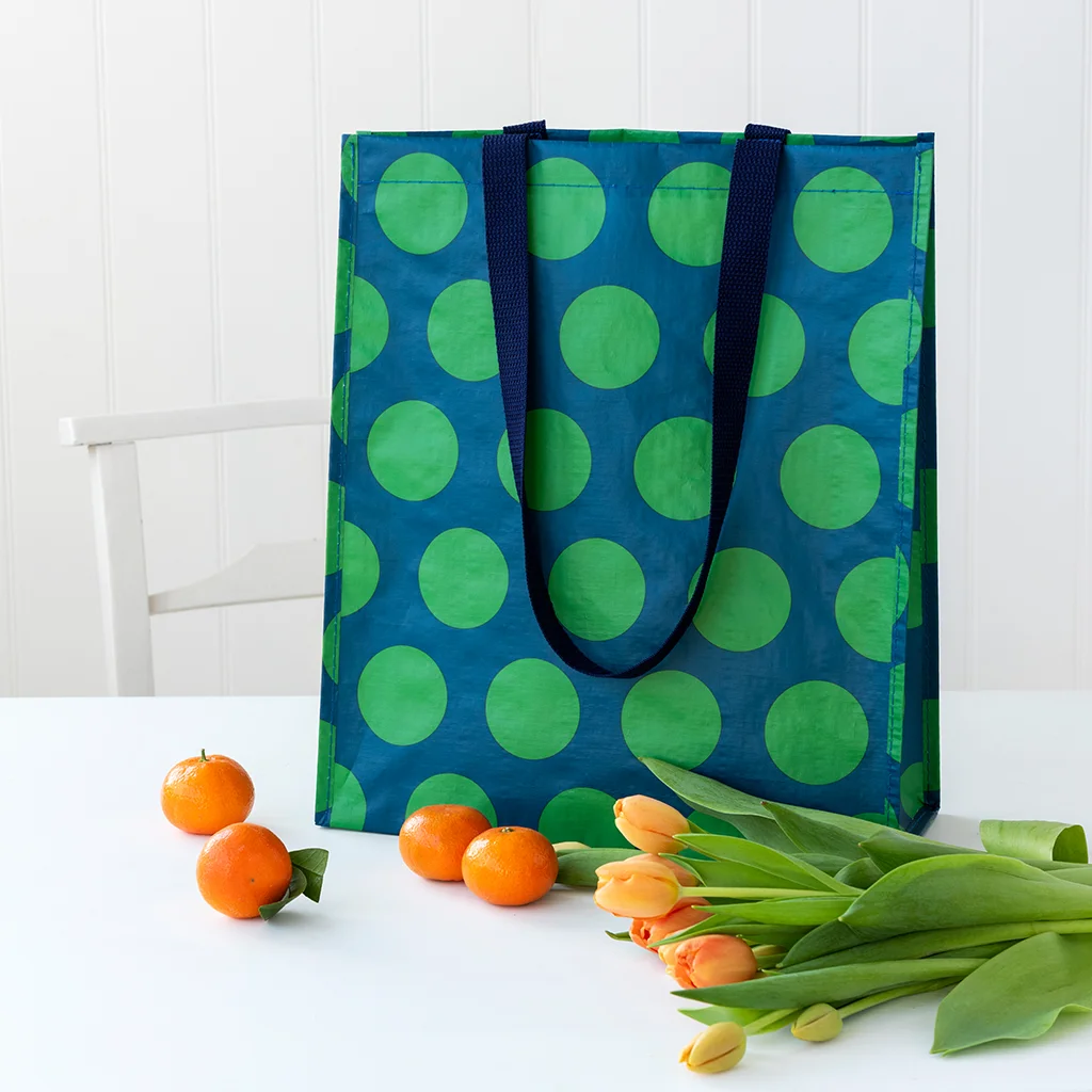 shopping bag - green on blue spotlight