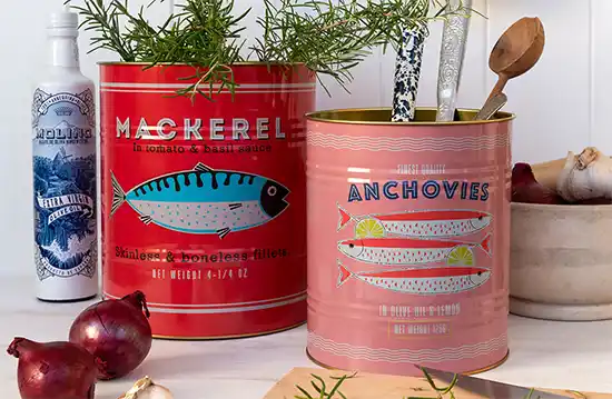 Retro style pink and red storage tins with fish print